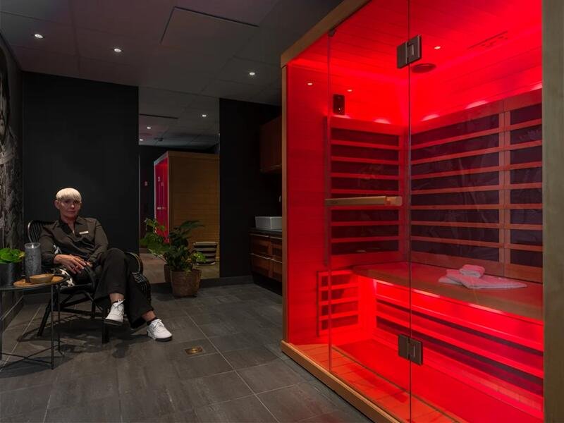 Hotel wellness center sauna with red light therapy