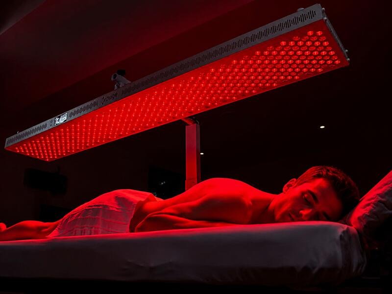 Wellness center treatment room with light therapy panel