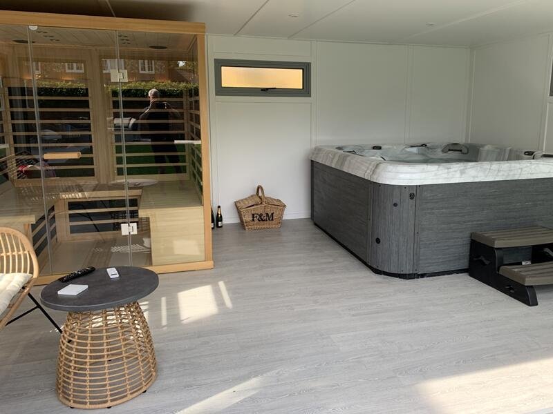 Luxury spa sauna suite with integrated red light panels