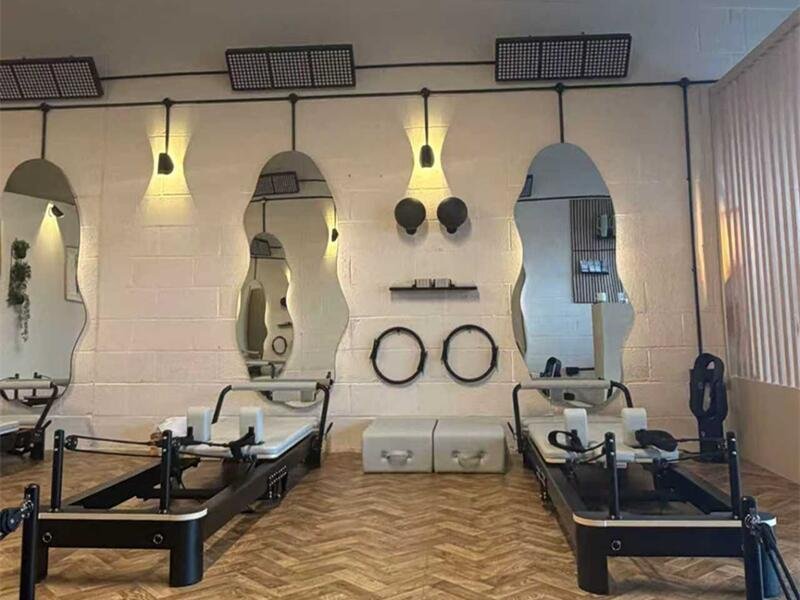 Dermatologist using handheld light therapy device for skin treatment