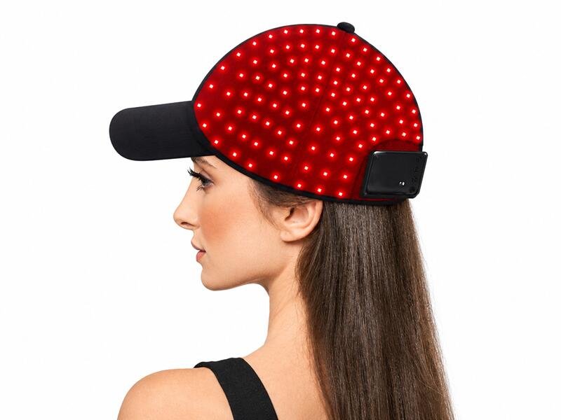 Woman Wearing Black LED Therapy Cap